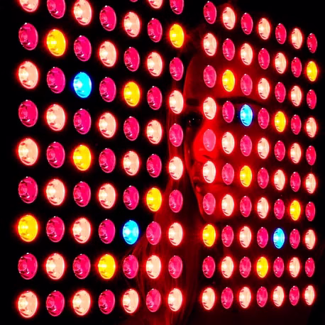 Close up of celler8 red light therapy panel showing red and blue lights shining.